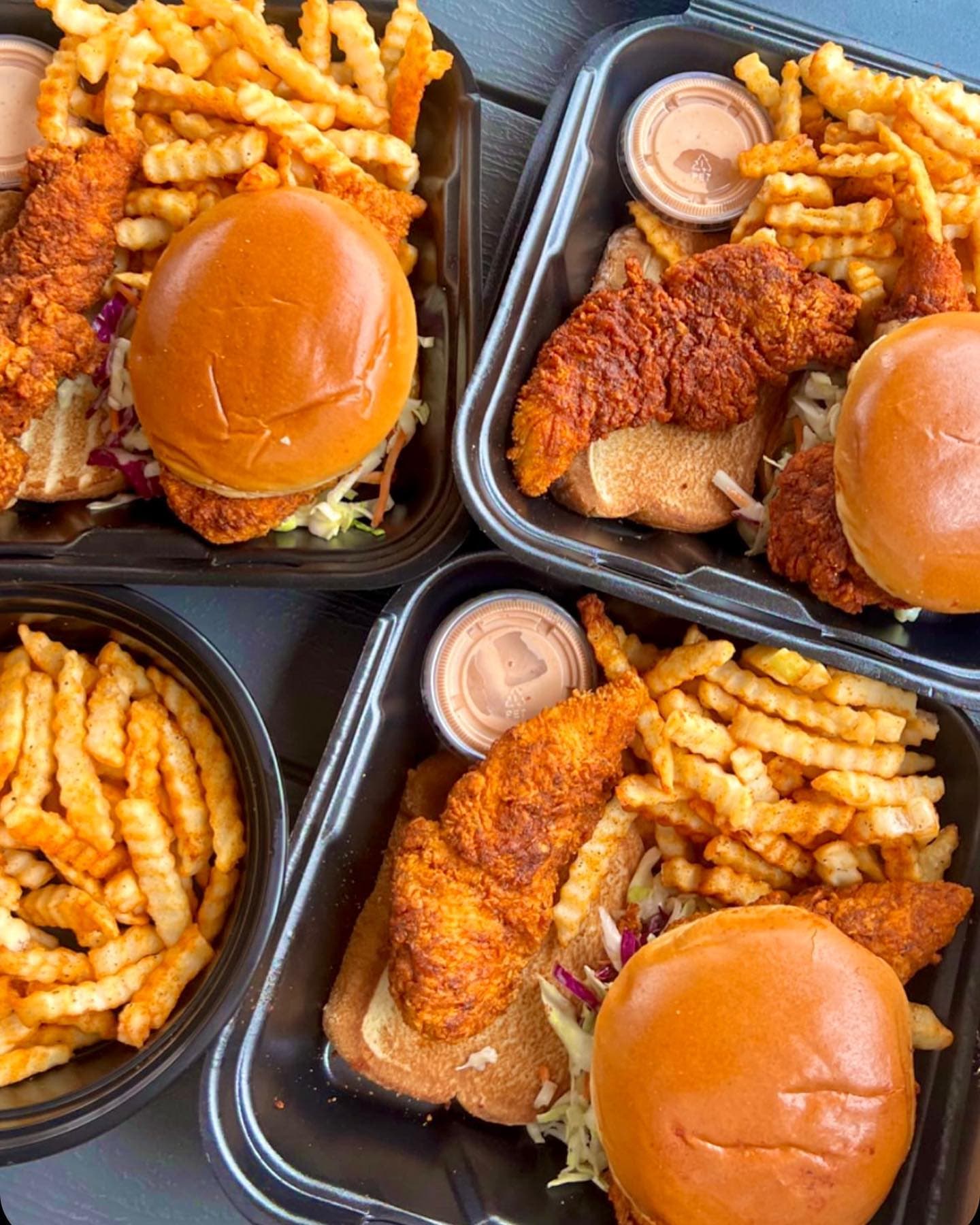 Four Chikin Drip combo trays of sliders, tenders and fries